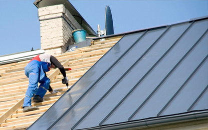 Honey Bees Roofing & Solar crew installing metal roofing in Burleson, TX