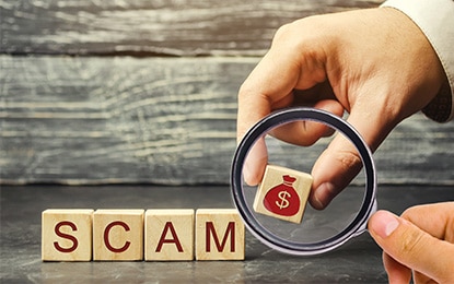 How to Avoid Roofing Scams - Image of blocks that spell scam