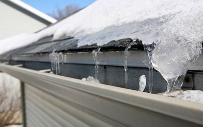 Snow and Ice on a roof in Texas showing winter roofing tips